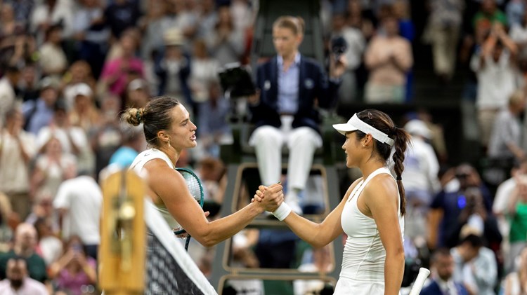 Emma Raducanu shakes hands with Aryna Sabalenka over the net after their third round match at Wimbledon