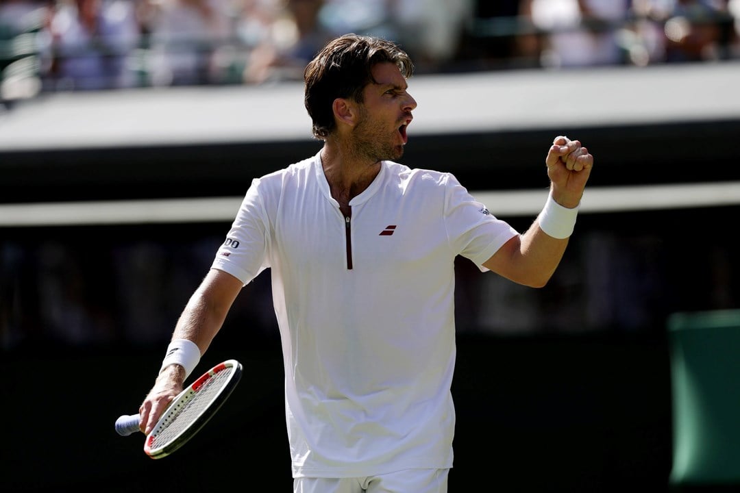 Cam Norrie pumping his fist in celebration at Wimbledon