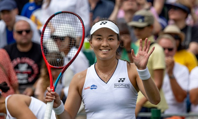 Lily Miyazaki waves to the camera after winning the first round of Wimbledon qualifiers