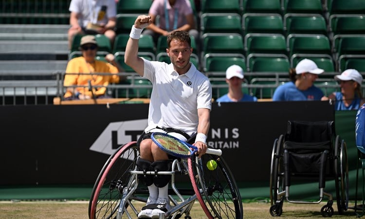 Alfie Hewett raises a fist in celebration after winning the Lexus British Open final