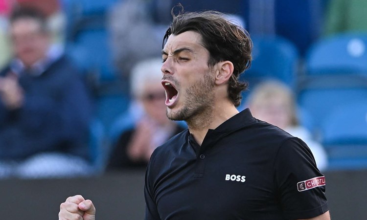 Taylor Fritz screaming while clenching his fist on court at the Rothesay International Eastbourne