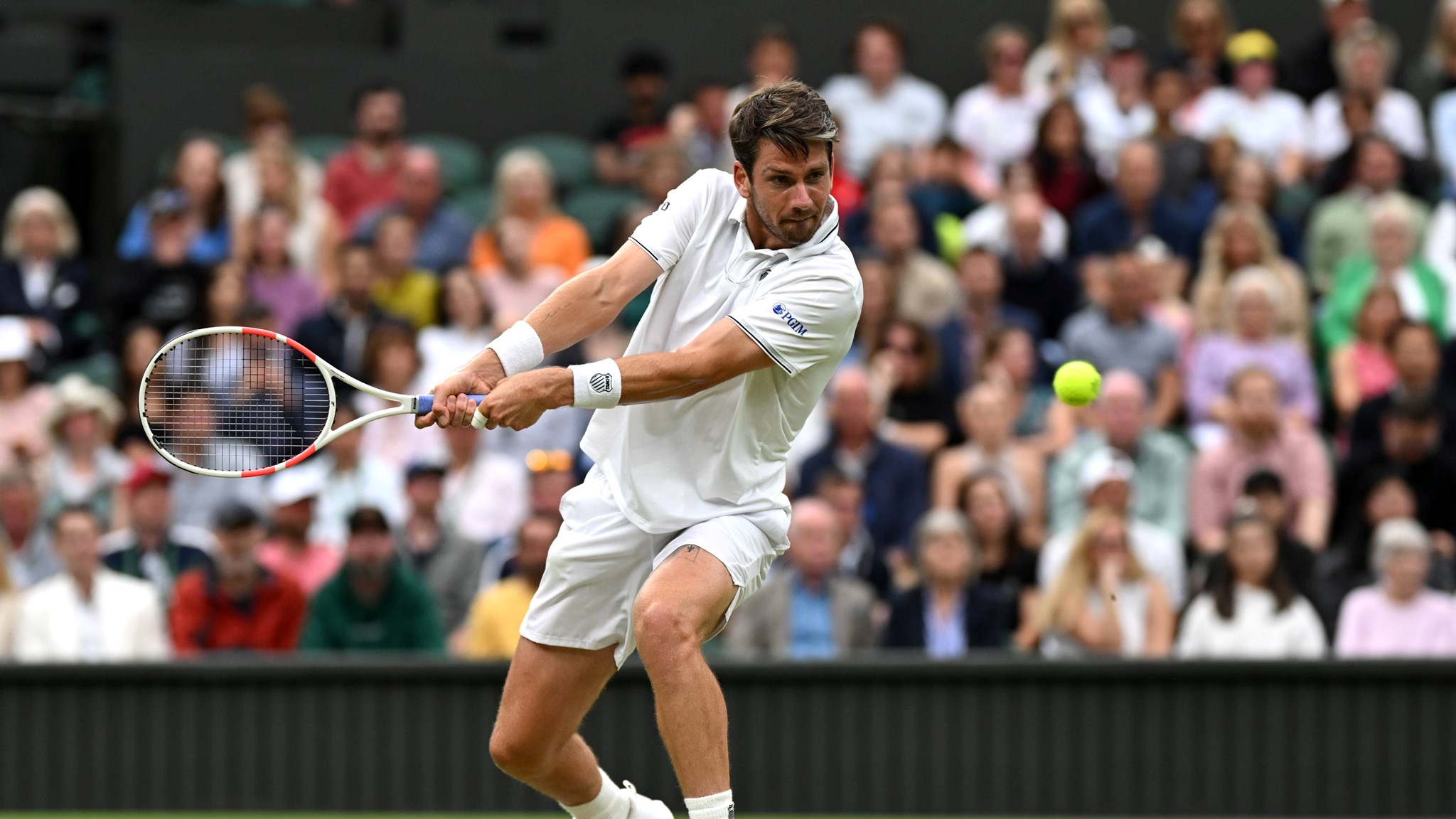 Cam Norrie lines up a backhand in the third roud of Wimbledon