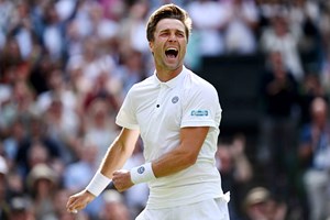 Liam Broady roars in celebration after securing a win against Casper Ruud on centre court at Wimbledon