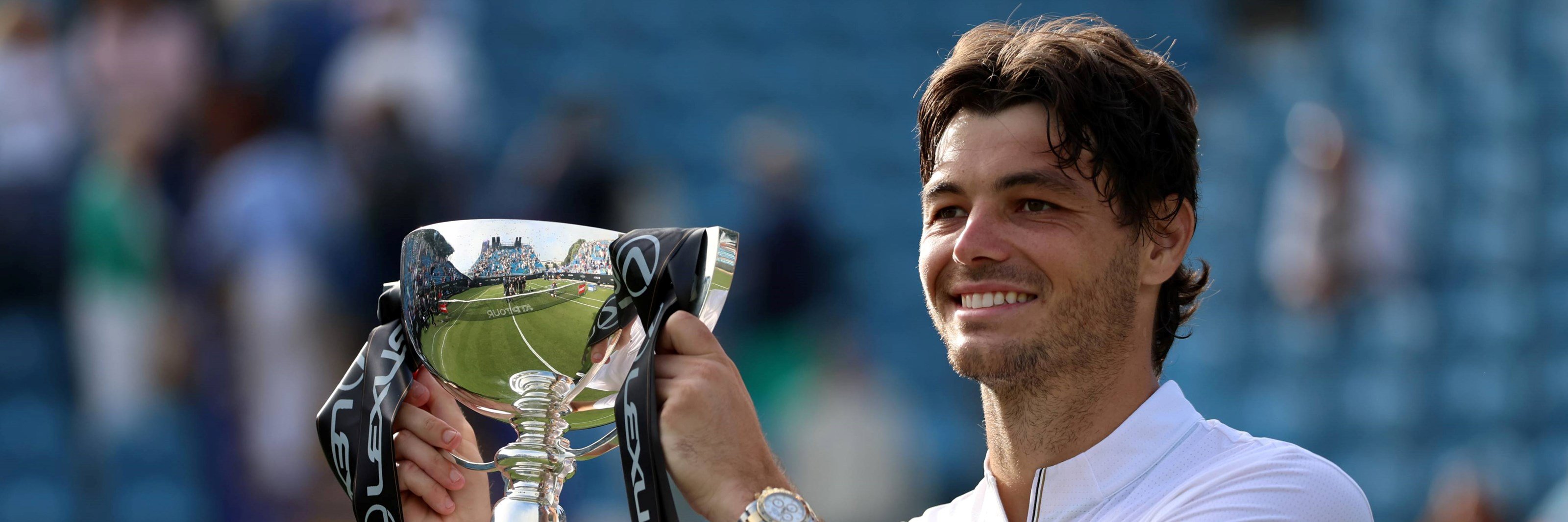 Taylor Fritz holding the Lexus Eastbourne Open trophy in 2025