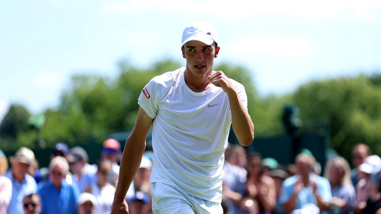 Oliver Tarvet pumps his fist during his first round win at Wimbledon 