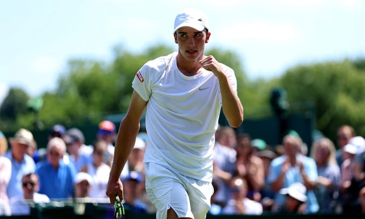 Oliver Tarvet pumps his fist during his first round win at Wimbledon 