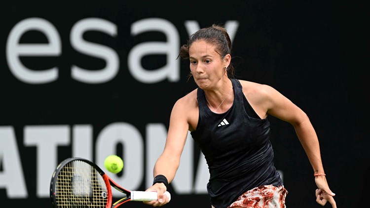 Daria Kasatkina on court at the Rothesay International hitting a forehand