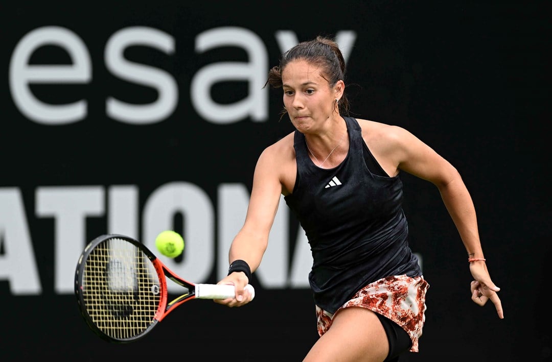 Daria Kasatkina on court at the Rothesay International hitting a forehand