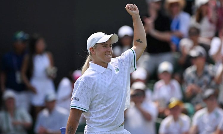 Sonay Kartal pumps her fist in celebration after beating Jelena Ostapenko at Wimbledon