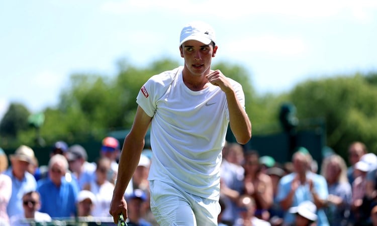 Oliver Tarvet pumps his fist during his first round win at Wimbledon 