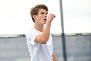 Zach Stephens fist pumps after winning a point at the Junior Nationals