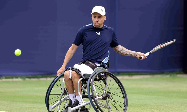 Andy Lapthorne lining up to his a forehand in his wheelchair on court at the Rothesay International
