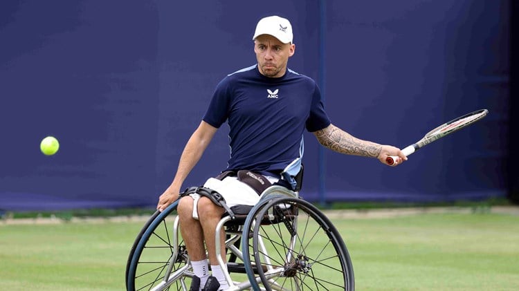 Andy Lapthorne lining up to his a forehand in his wheelchair on court at the Rothesay International