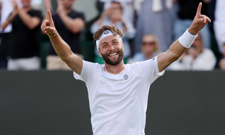 Liam Broady celebrates reaching the third round at Wimbledon for the first time