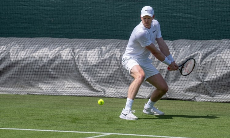 Kyle Edmund hitting a forehand in practice at Wimbledon