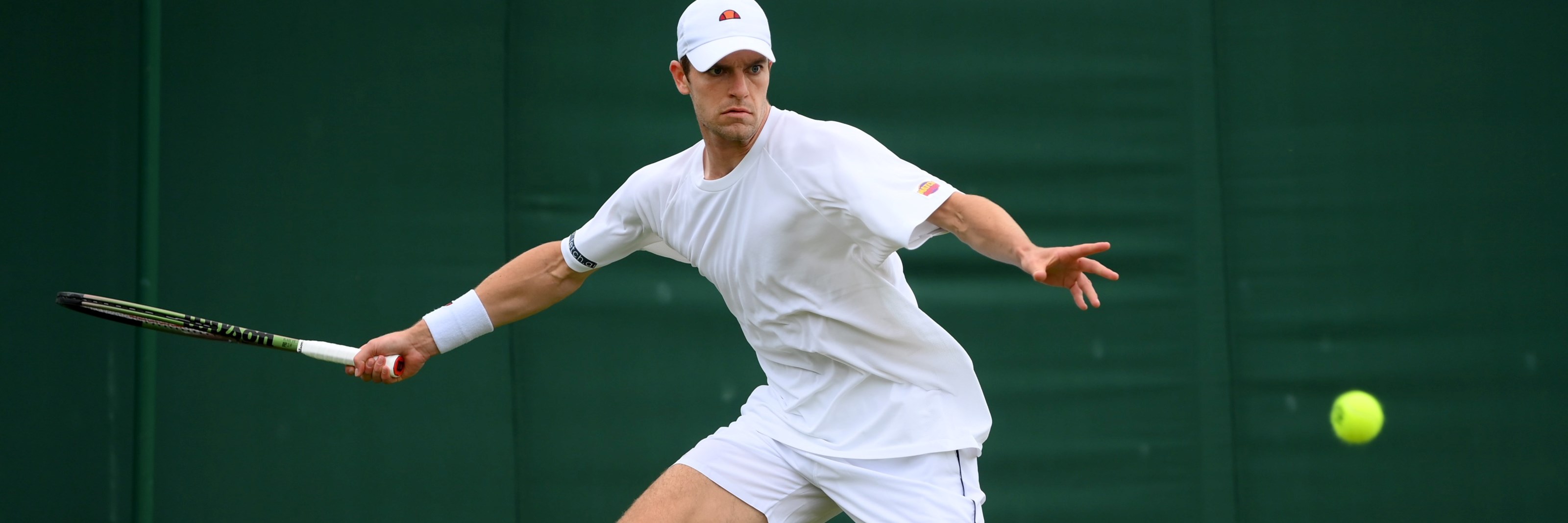 Alastair Gray in action during his second round match against Taylor Fritz at Wimbledon 2022