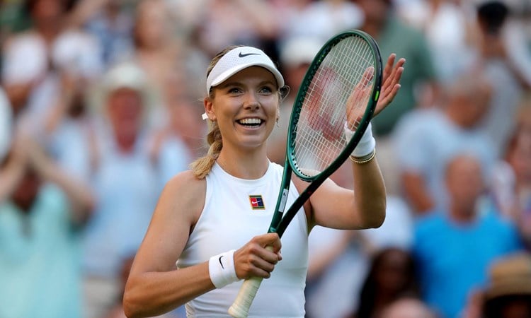 Katie Boulter smiles and claps the crowd after a first round win at Wimbledon