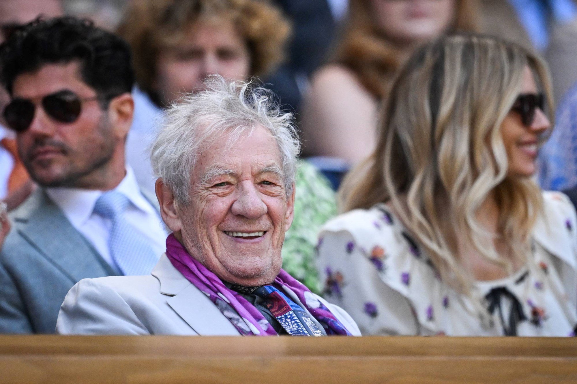 Sir Ian McKellen smiling and laughing during quarter-finals day at The Championships, Wimbledon