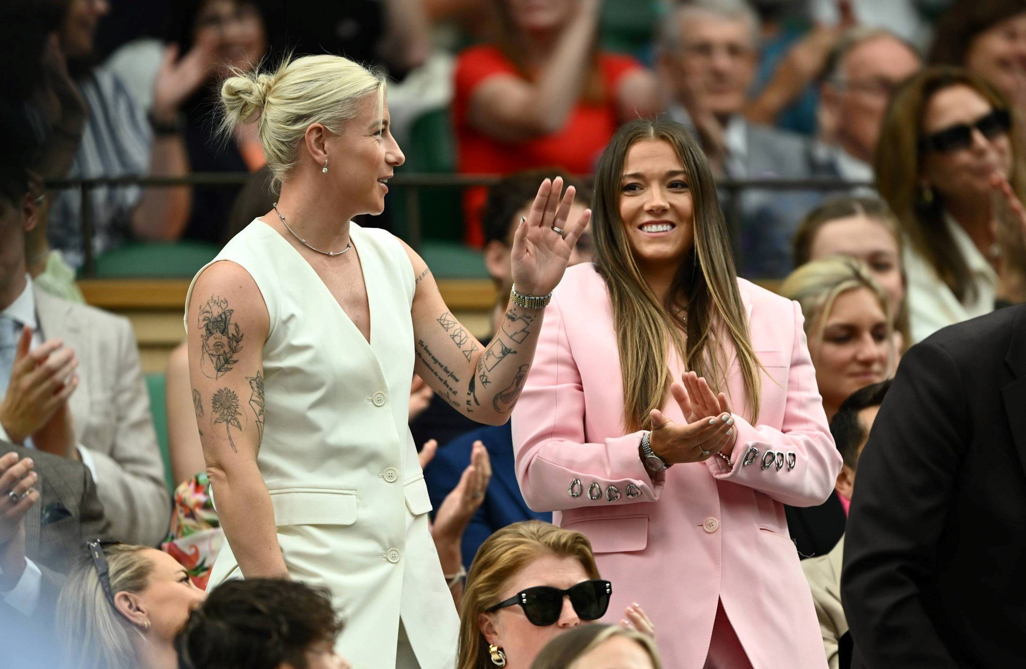 Lionnesses Beth England and Fran Kirby wave to the fans on arrival at the Royal Box on Centre Court