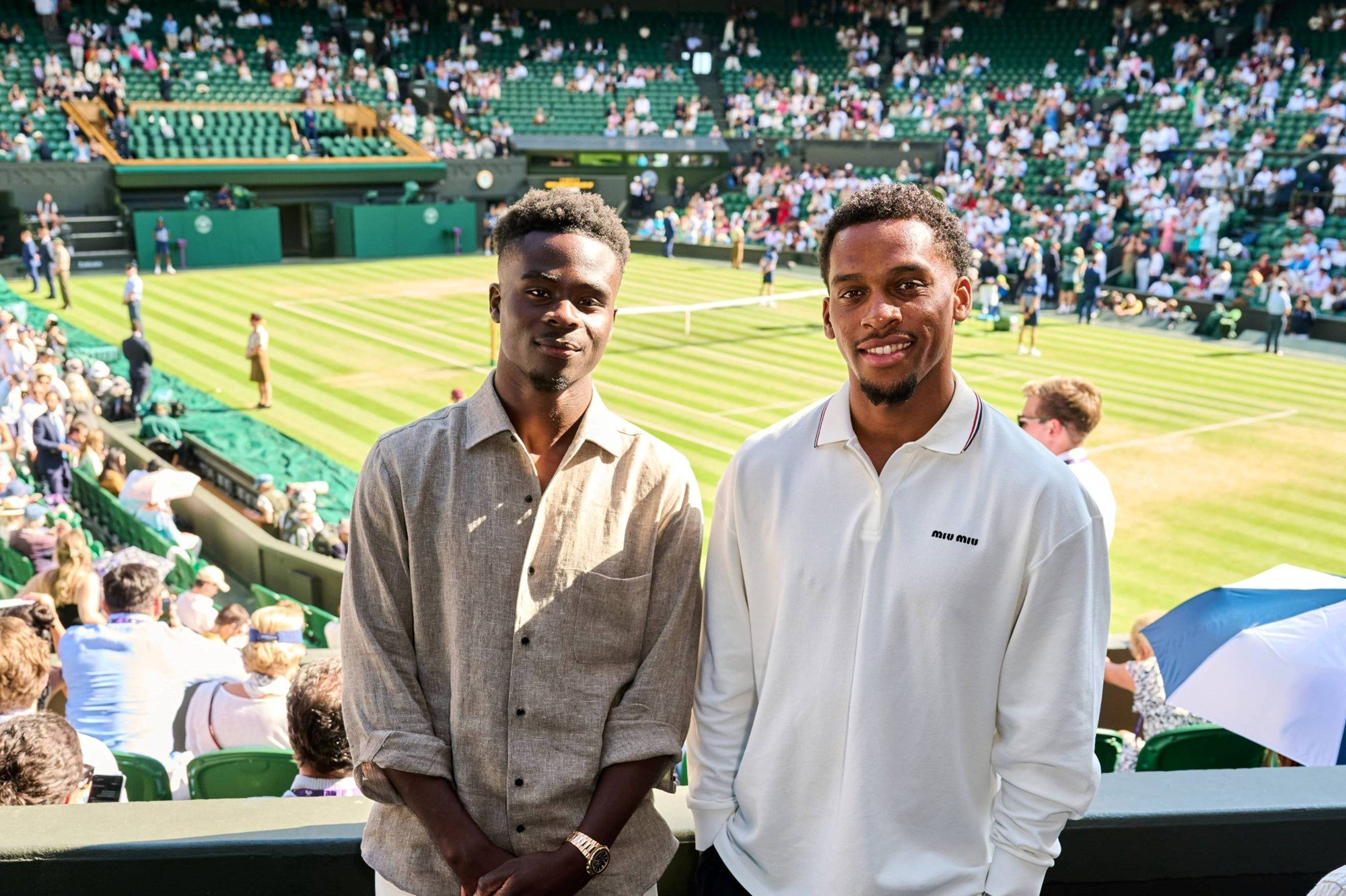 Arsenal football stars Bukayo Saka and Jurrien Timber in attendance on Wimbledon's Centre Court