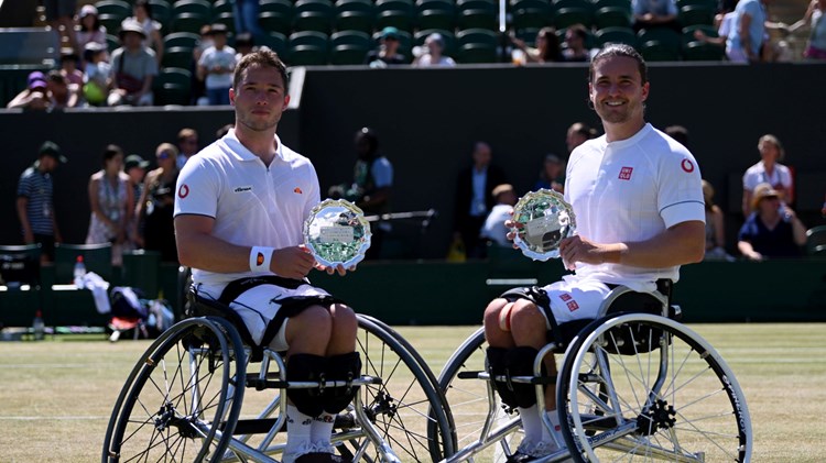 Alfie Hewett and Gordon Reid posing with their runners-up trophies after the men's Wheelchair doubles final at the 2022 Championships Wimbledon