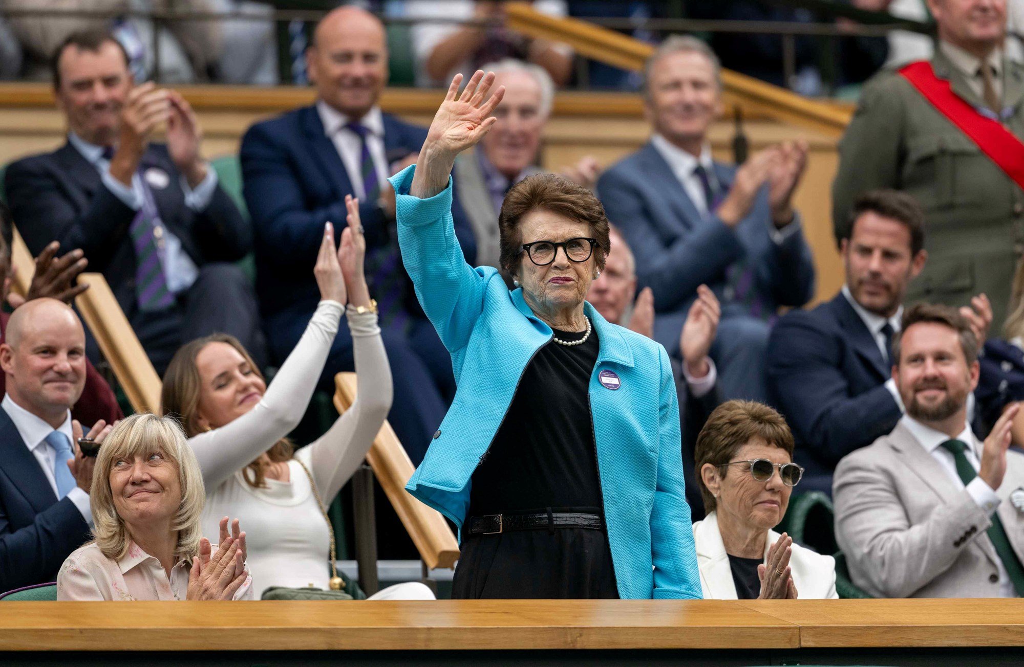Tennis legend Billie Jean King waves to the Centre Court crowd from the Royal Box