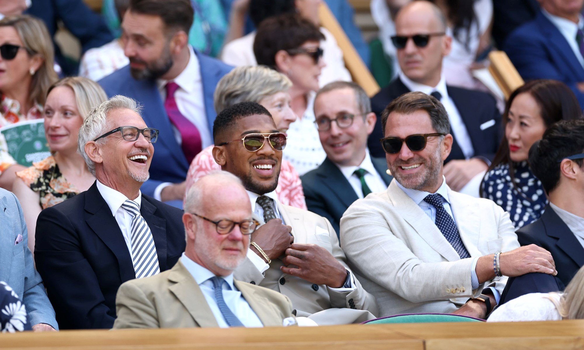 Gary Lineker, Anthony Joshua and Eddie Hearn enjoying the action on Centre Court at Wimbledon