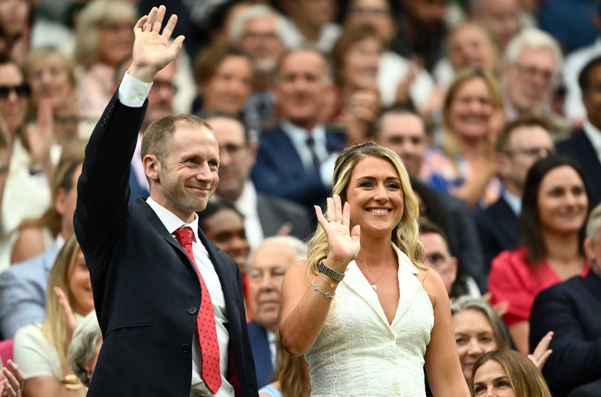 Jason and Laura Kenny stand to wave at the crowd from the Royal Box at Wimbledon