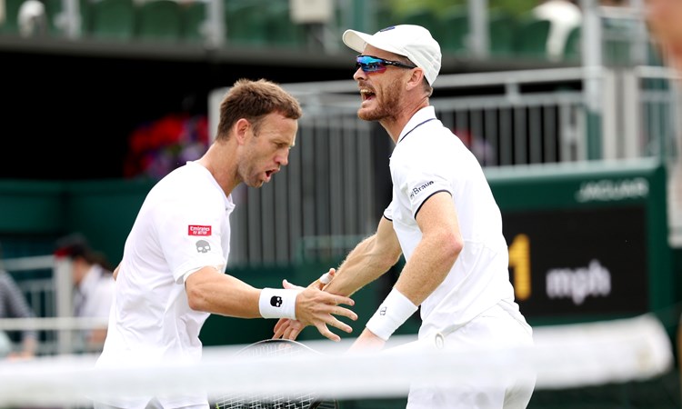 Jamie Murray of Great Britain and partner Michael Venus of New Zealand celebrate against Alexander Erler of Austria and Lucas Miedler of Austria in the Men's Doubles Second Round match during day seven of The Championships Wimbledon 2023 at All England Lawn Tennis and Croquet Club on July 09, 2023 in London, England. 