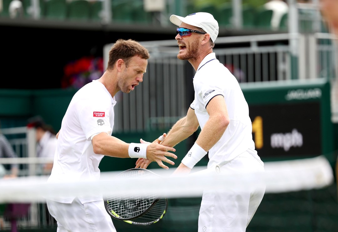 Jamie Murray of Great Britain and partner Michael Venus of New Zealand celebrate against Alexander Erler of Austria and Lucas Miedler of Austria in the Men's Doubles Second Round match during day seven of The Championships Wimbledon 2023 at All England Lawn Tennis and Croquet Club on July 09, 2023 in London, England. 