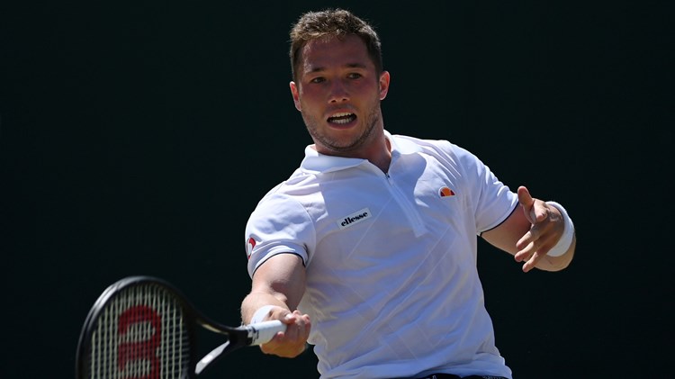 Alfie Hewett hitting a forehand on court at 2022 Wimbledon