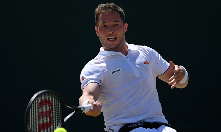 Alfie Hewett hitting a forehand on court at 2022 Wimbledon