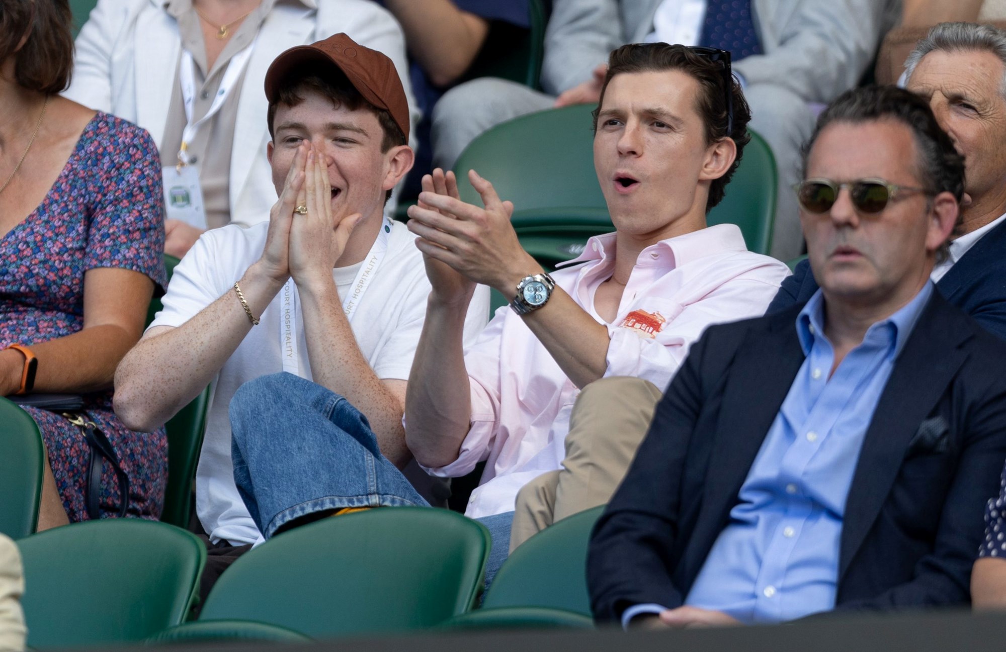 Spiderman actor Tom Holland clapping alongside his brother at Wimbledon