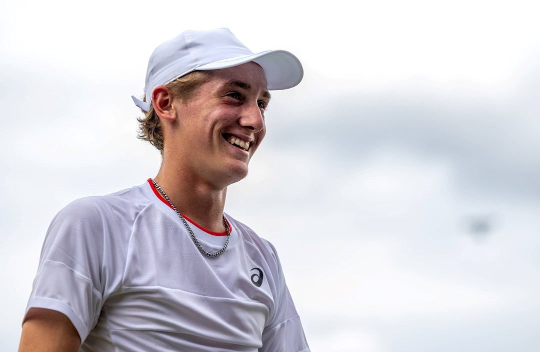 Henry Searle smiles after reaching the quarter-finals at Junior Wimbledon