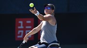 Cornelia Oosthuizen serving during her wheelchair women's singles quarter-final match at the 2022 British Open  