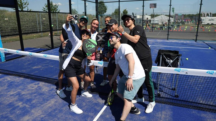 Fans taking a selfie at the padel pop-up event at the British Grand Prix