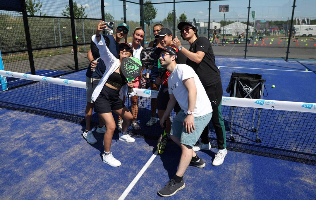 Fans taking a selfie at the padel pop-up event at the British Grand Prix