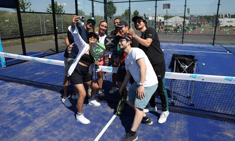 Fans taking a selfie at the padel pop-up event at the British Grand Prix