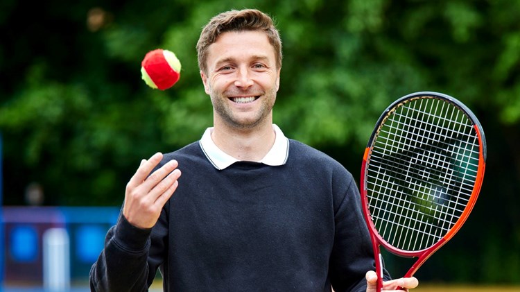Liam Broady smiling during a visit to St Malachy RC Primary School