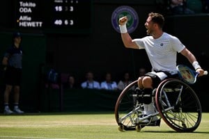 Alfie Hewett celebrates to the crowd after winning a bit point in the 2025 Wimbledon men's wheelchair singles final