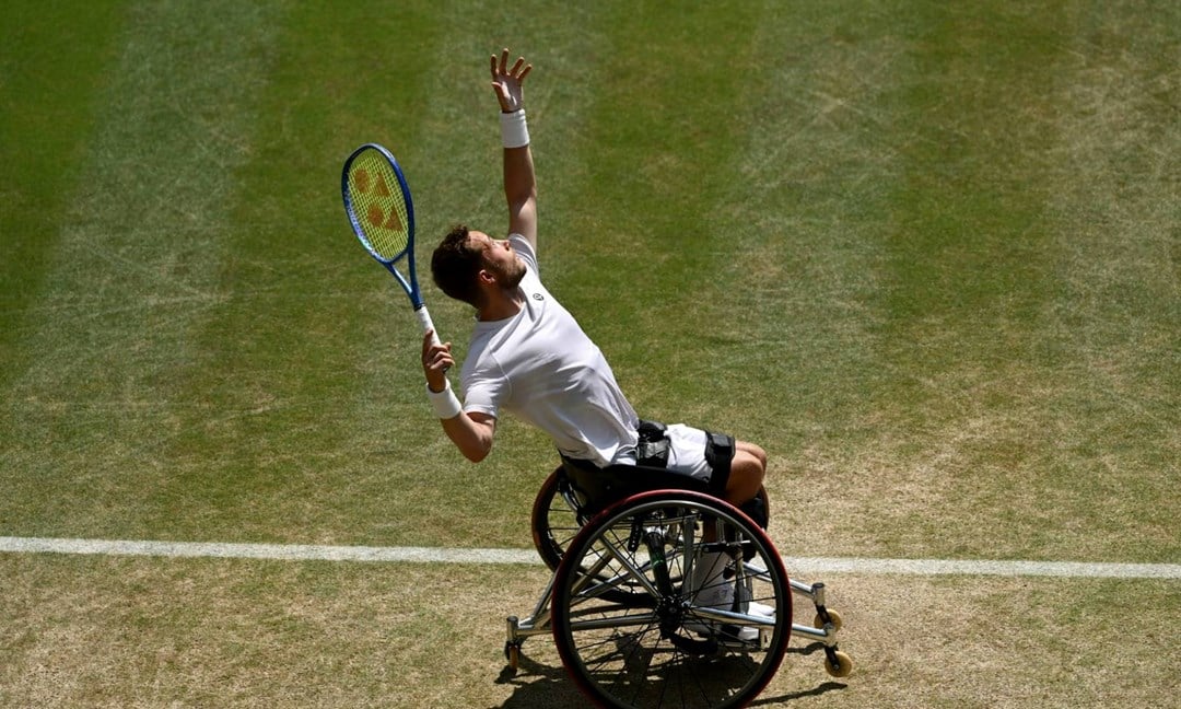 Alfie Hewett hits a serve during the final of the men's wheelchair singles at Wimbledon