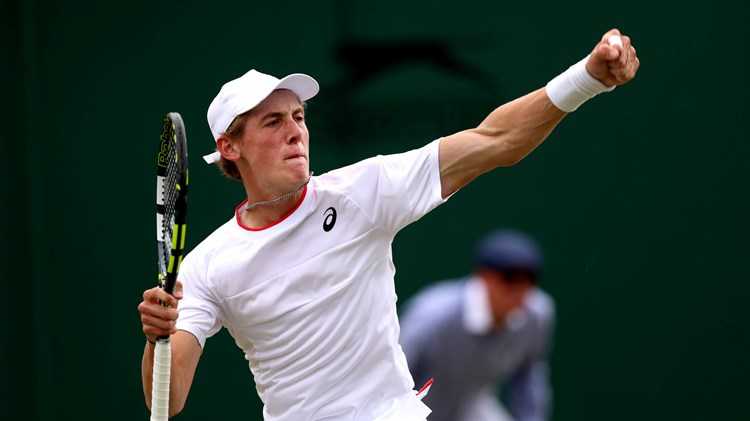 Henry Searle celebrates reaching the Boys' singles semi-final at Wimbledon 