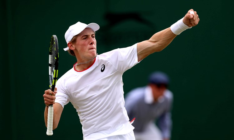 Henry Searle celebrates reaching the Boys' singles semi-final at Wimbledon 