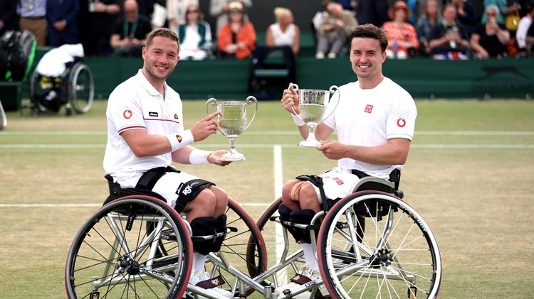 Alfie Hewett and Gordon Reid holding their sixth Wimbledon doubles title