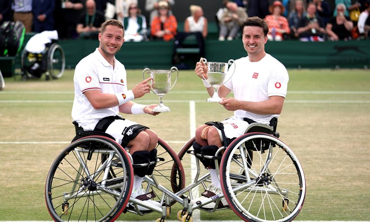 Alfie Hewett and Gordon Reid holding their sixth Wimbledon doubles title