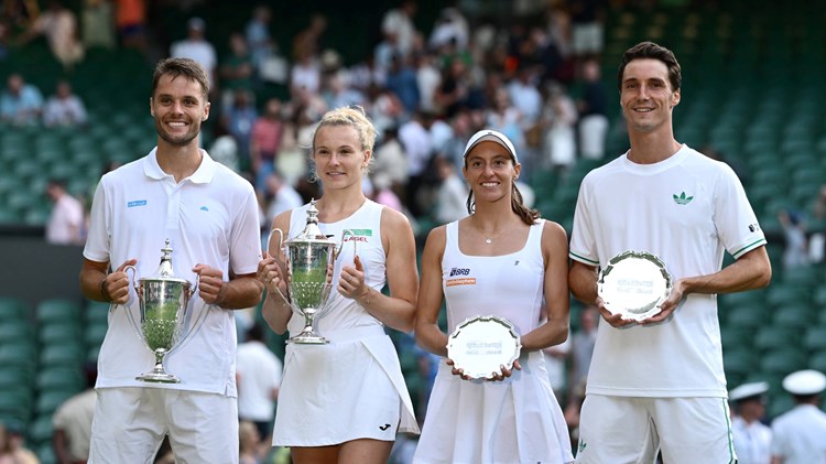 Joe Salisbury and Luisa Stefani smile while holding up their Wimbledon mixed doubles trophies next to  Sem Verbeek and  Katerina Siniakova who are holding up the champions trophy