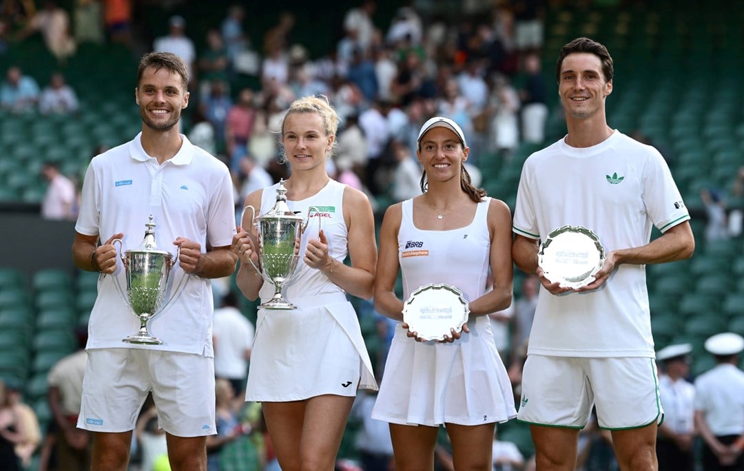 Joe Salisbury and Luisa Stefani smile while holding up their Wimbledon mixed doubles trophies next to  Sem Verbeek and  Katerina Siniakova who are holding up the champions trophy