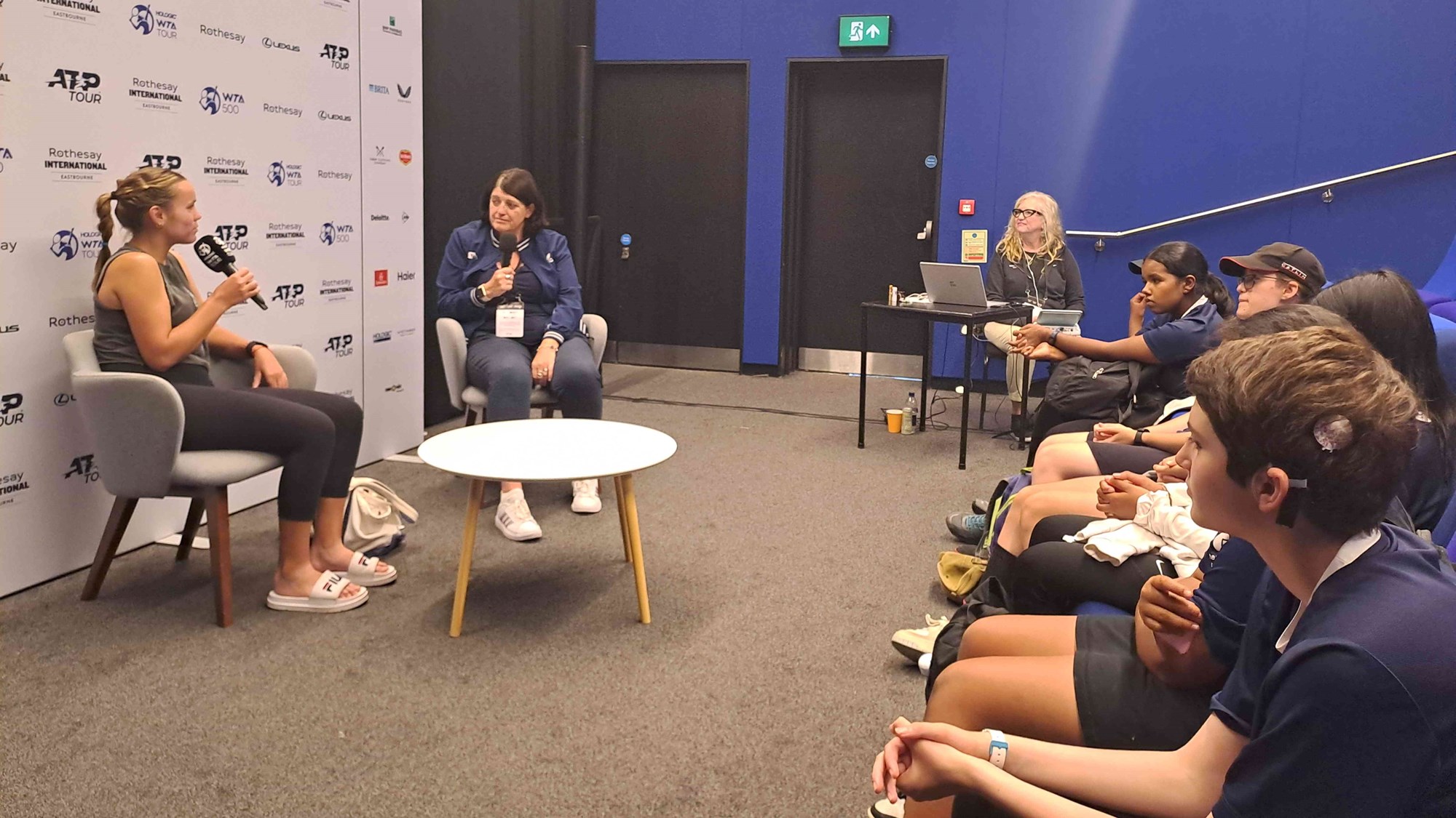 Tennis player Sofia Kenin being interviewed by children as part of the media experience