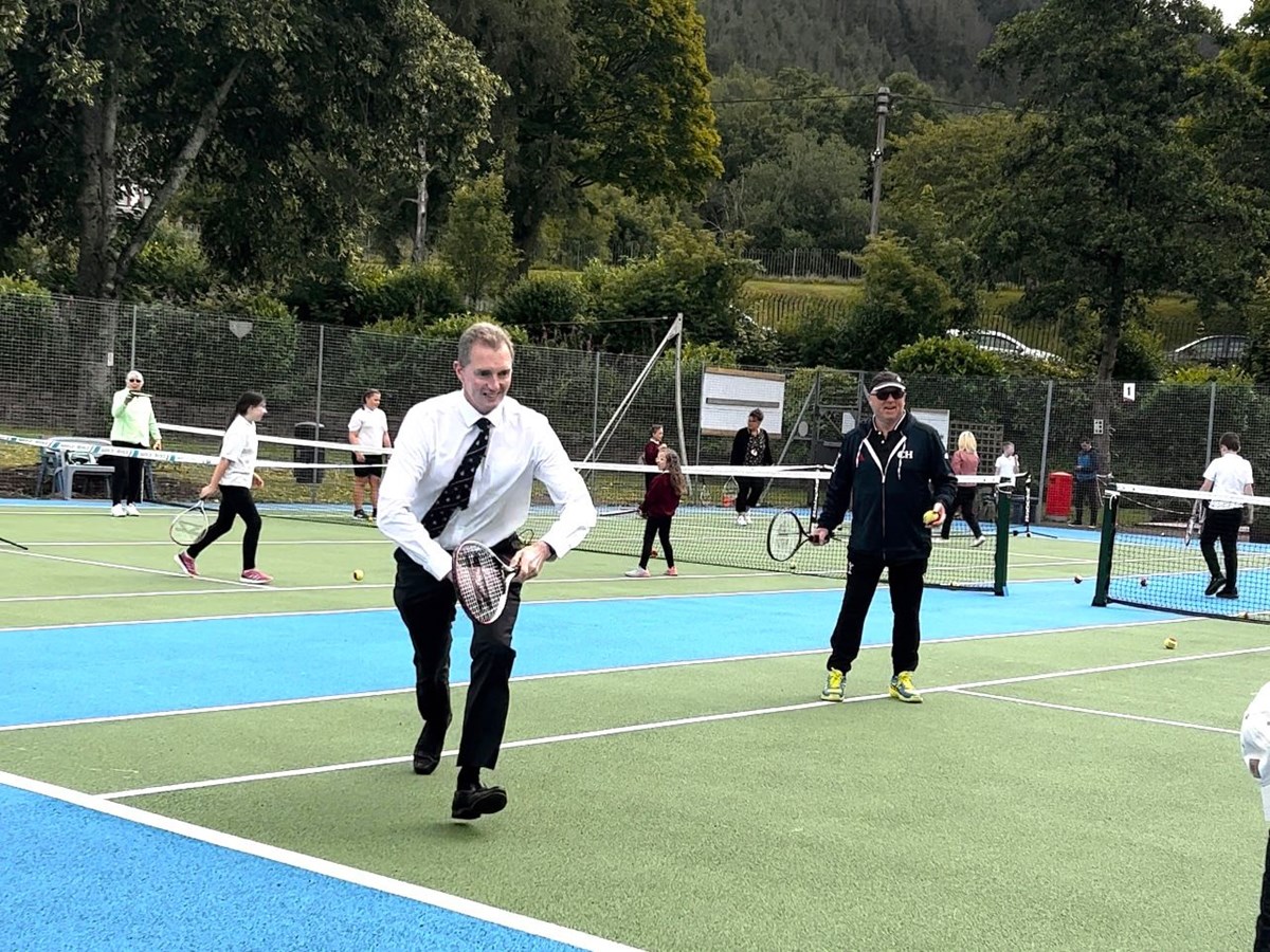 David TC Davies MP pictured during his visit to the refurbished tennis court at Six Bells Park in Abertillery, Wales. 