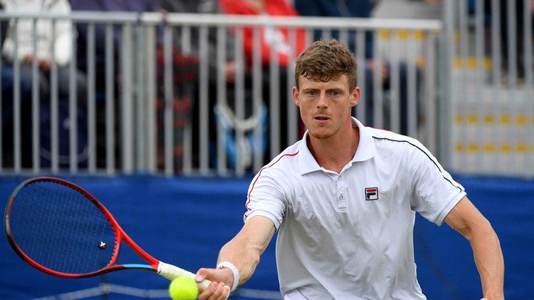 Billy Harris hitting a forehand on court at the Wimbledon qualifiers